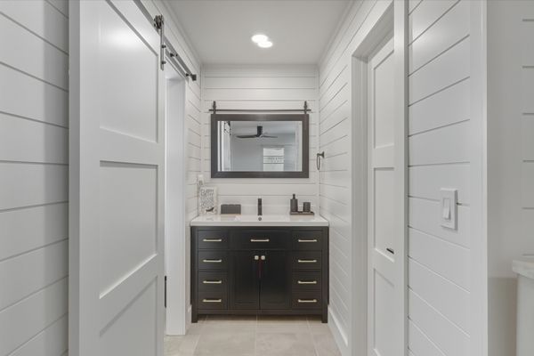 Bedroom 1's attached bathroom with walk-in shower and lots of closet space