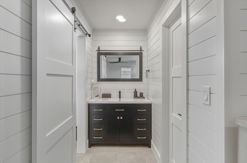 Bedroom 1's attached bathroom with walk-in shower and lots of closet space