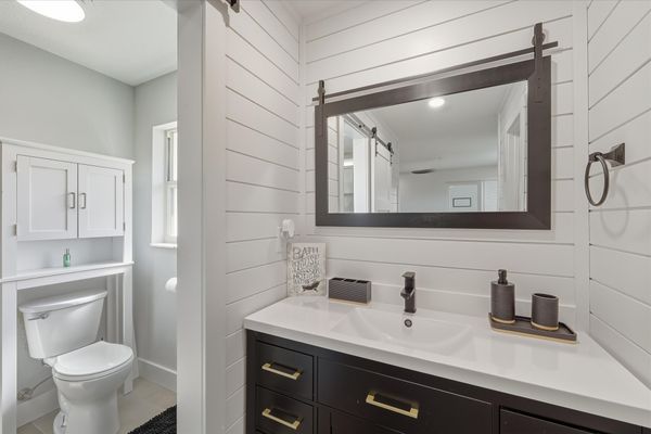 Bedroom 1's attached bathroom with walk-in shower and lots of closet space
