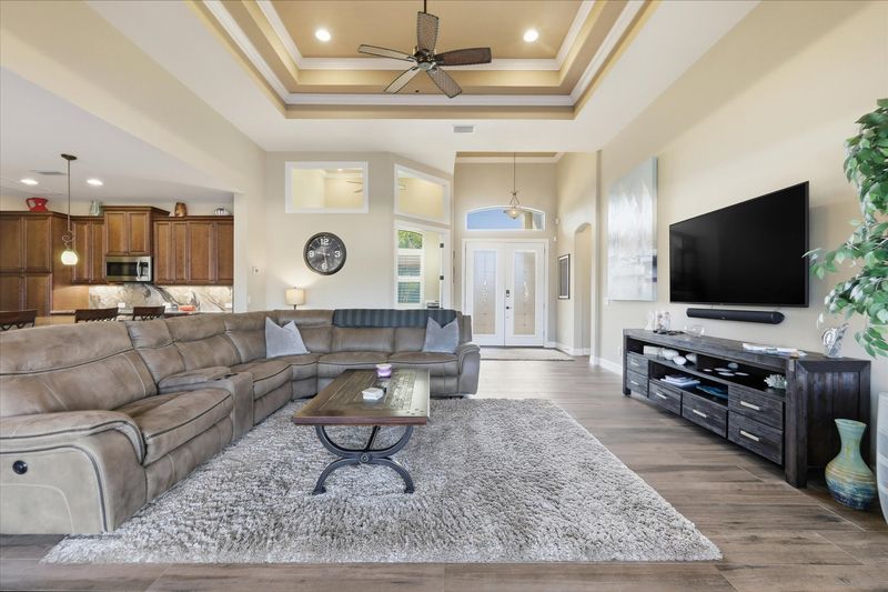 Living room with comfy seating and 70-inch Smart TV