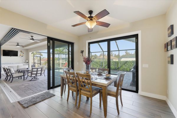 Dining area with pool view. Dining table seats 6