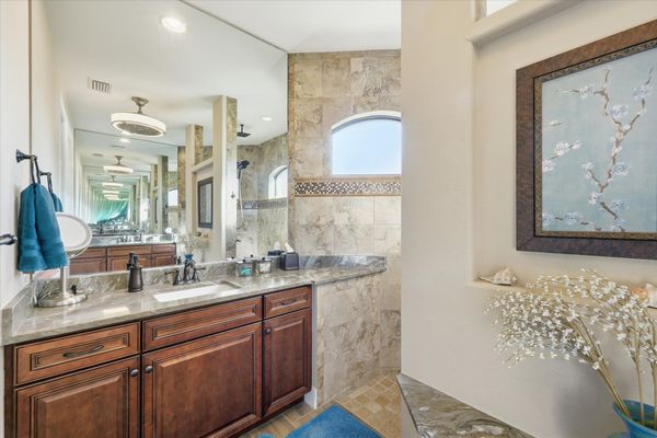 Primary en suite with large walk-in shower and double vanities
