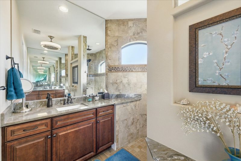 Primary en suite with large walk-in shower and double vanities