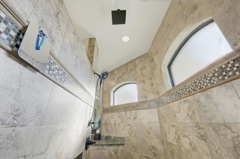 Primary en suite with large walk-in shower and double vanities