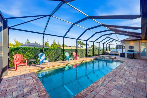 Sparkling saltwater pool & spa overlooking the canal