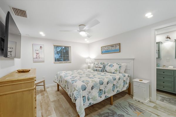 Bedroom 1 with king bed, attached bathroom and 55-inch Smart TV