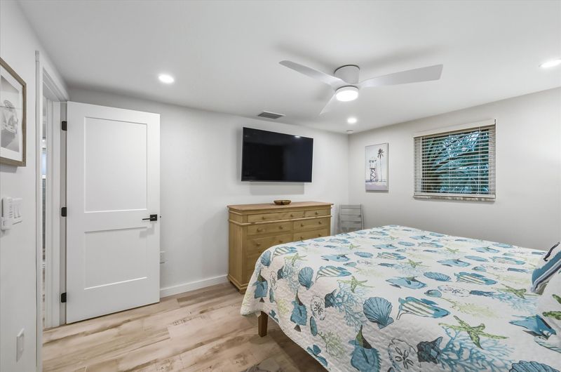 Bedroom 1 with king bed, attached bathroom and 55-inch Smart TV