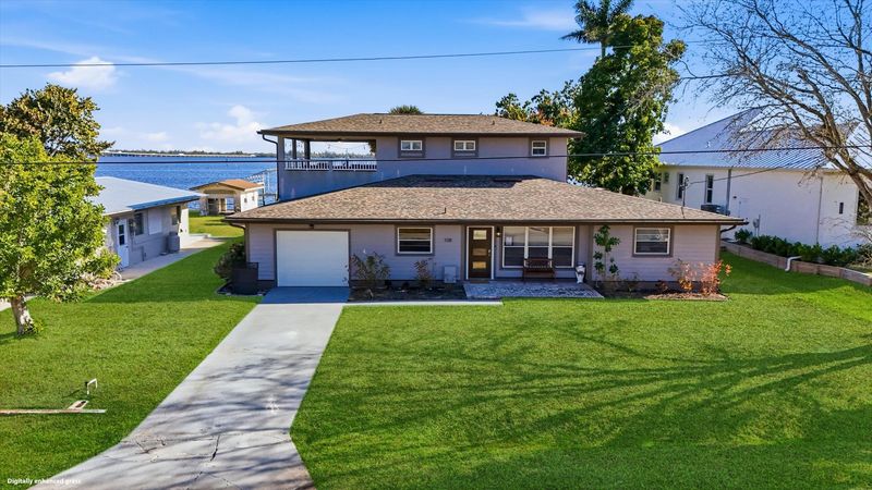 Gorgeous 4 bedroom, 3 bathroom, 2 story waterfront home with private pool on Peace River in Punta Gorda, FL