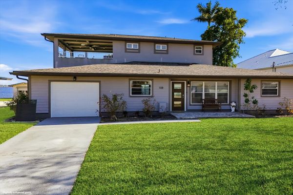 Gorgeous 4 bedroom, 3 bathroom, 2 story waterfront home with private pool on Peace River in Punta Gorda, FL