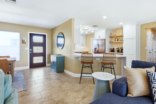 Beautiful open living space overlooking the sparkling pool with an amazing view of the Peace River