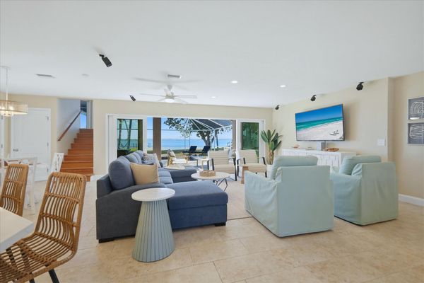 Beautiful open living space overlooking the sparkling pool with an amazing view of the Peace River