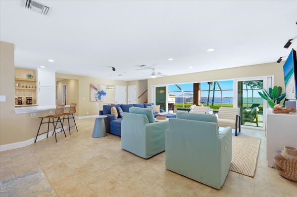 Beautiful open living space overlooking the sparkling pool with an amazing view of the Peace River