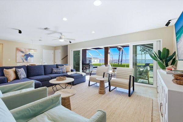 Living room features lots of comfy seating and 70-inch Smart TV