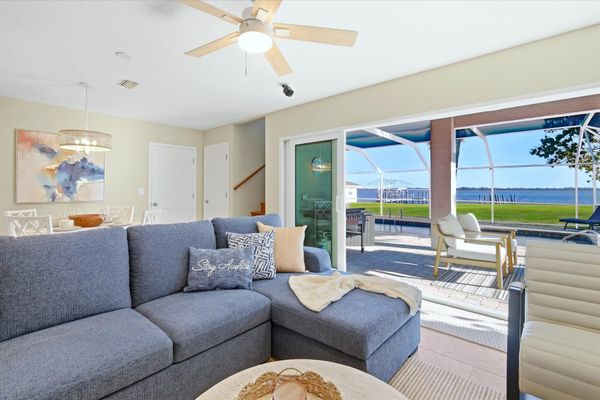 Living room features lots of comfy seating and 70-inch Smart TV