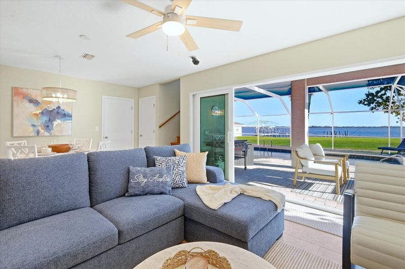 Living room features lots of comfy seating and 70-inch Smart TV