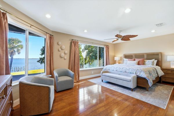 Bedroom 1 - king bedroom suite with an amazing view of Peace River, attached bathroom, private balcony, and 55-inch Smart TV