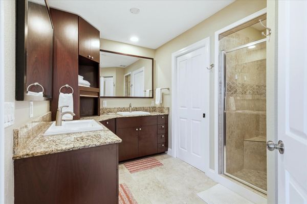Upstairs bathroom with walk-in shower and double vanities