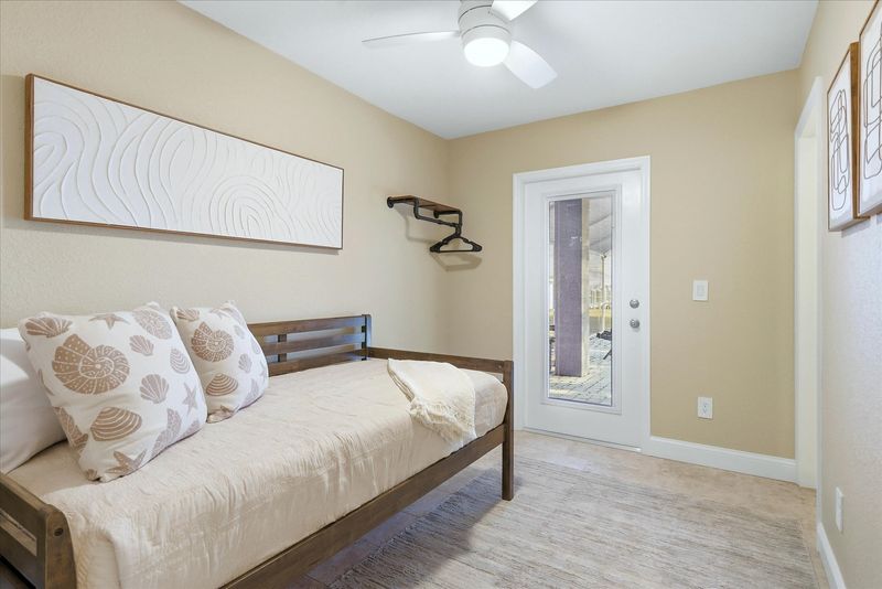 Bedroom 4 - Downstairs with twin daybed with twin trundle bed, lanai access and attached bathroom