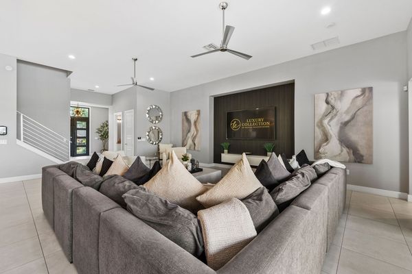 Plenty of comfortable seating options for everyone to gather around the SMART TV