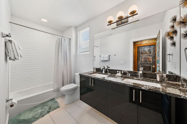 The ensuite bathroom has a shower/tub combo for the kids