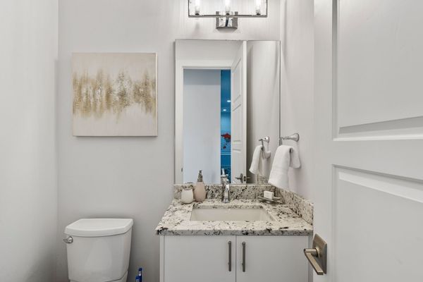 A hallway half bathroom