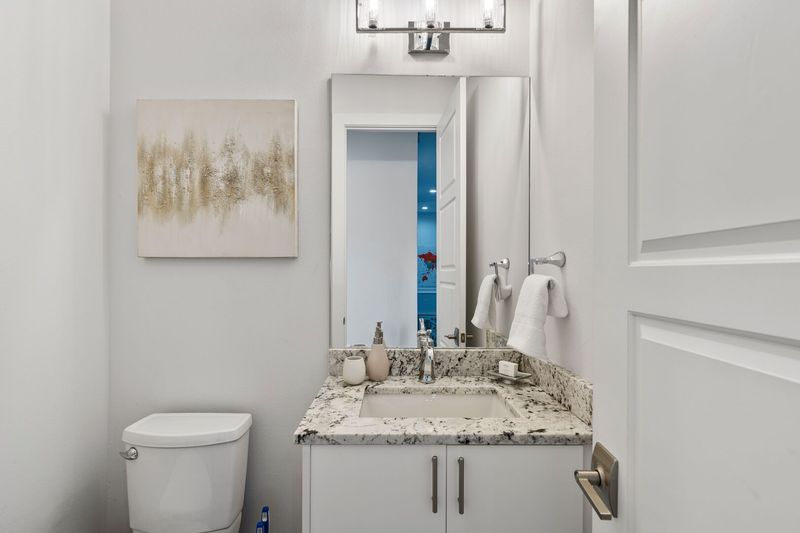 A hallway half bathroom