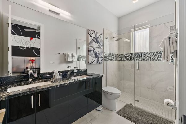 The ensuite bathroom with elegant details and a walk-in shower