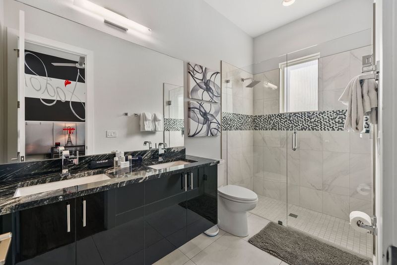 The ensuite bathroom with elegant details and a walk-in shower