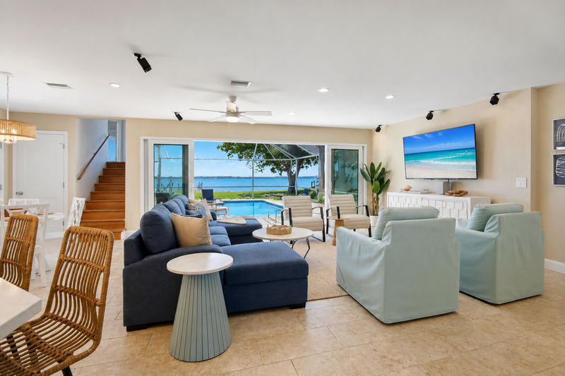 Beautiful open living space overlooking the sparkling pool with an amazing view of the Peace River