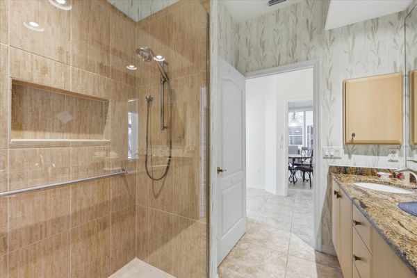 Guest bathroom with walk-in shower and double vanities