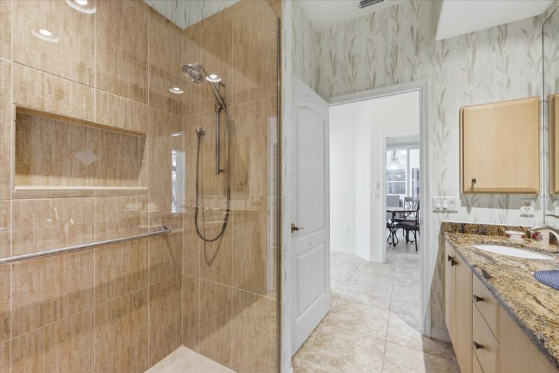 Guest bathroom with walk-in shower and double vanities