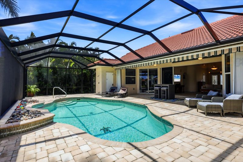 Sparkling pool overlooking the canal. Pool size: 28' x 14' x 6'D
