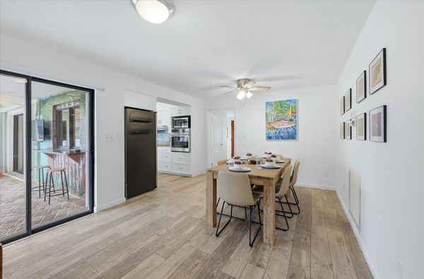 Dining room with lanai access. Dining table seats 6