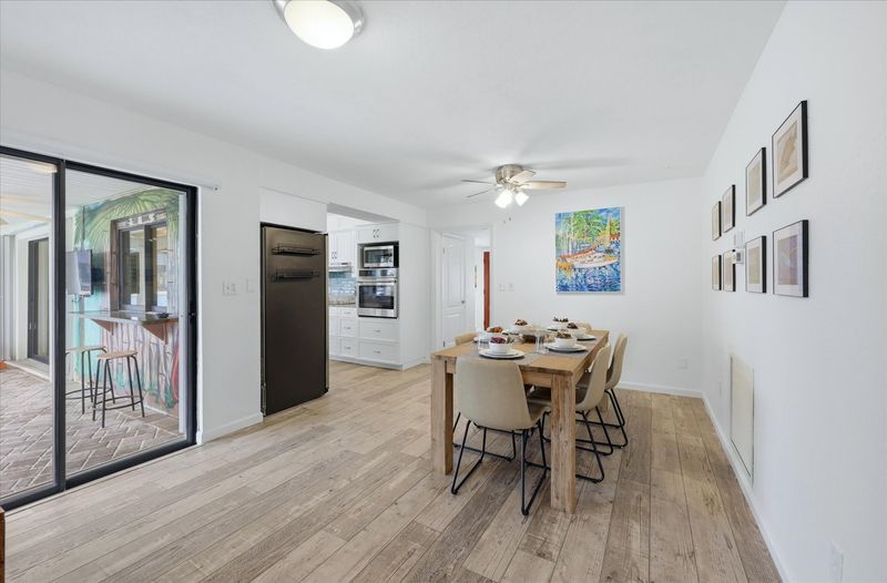 Dining room with lanai access. Dining table seats 6