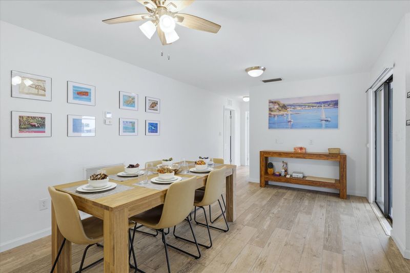 Dining room with lanai access. Dining table seats 6