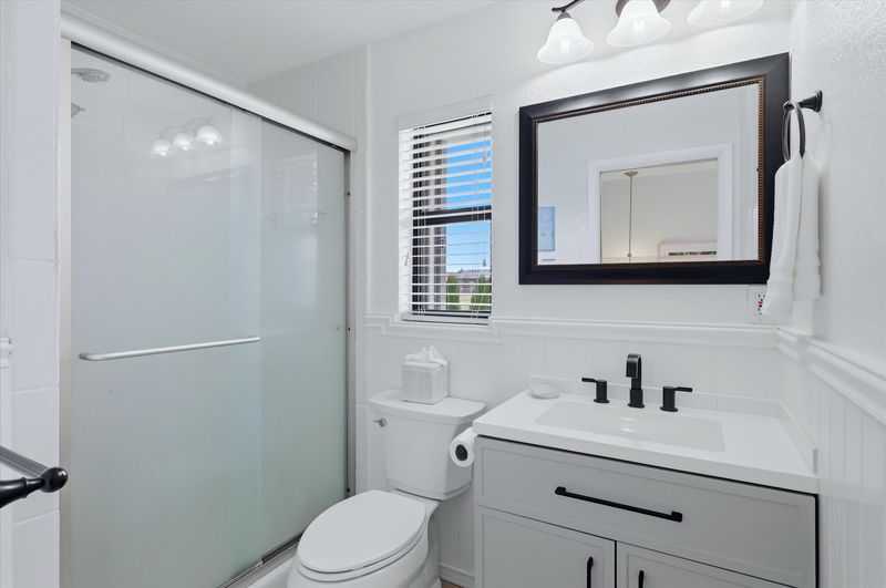 Bedroom 2's attached bathroom with walk-in shower