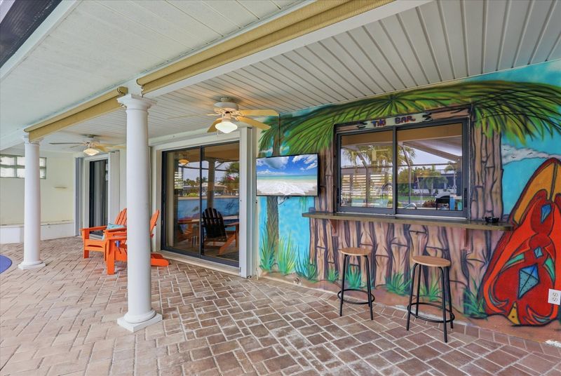 Large lanai with private sparkling pool is perfect for entertaining. Features sun loungers, dining table that seats 6, and 43-inch Smart TV