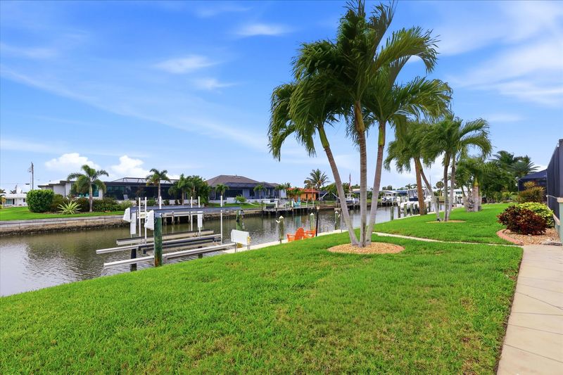 Backyard leading to canal and boat dock (boat lift is not for guest use)