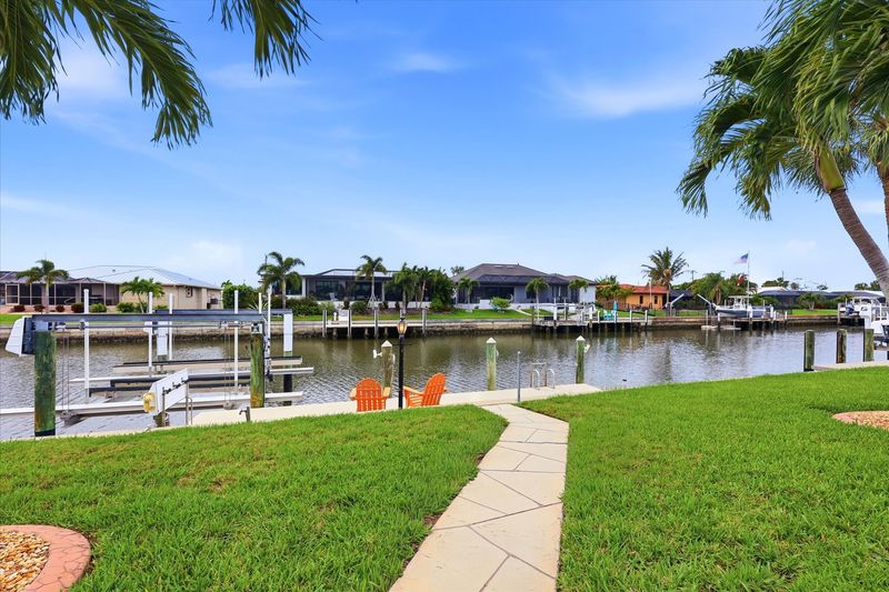 Backyard leading to canal and boat dock (boat lift is not for guest use)