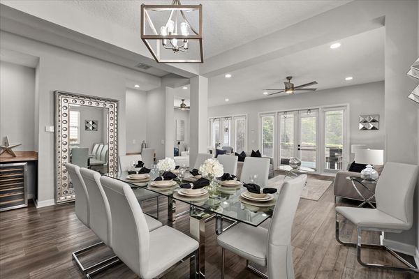A modern dining room with a spacious design, ideal for family gatherings
