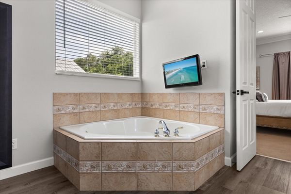 A luxurious bathtub with a scenic view, perfect spot to unwind in style.