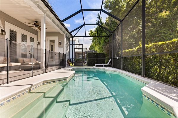 Soak up the sunshine in your private screened-in pool and patio oasis