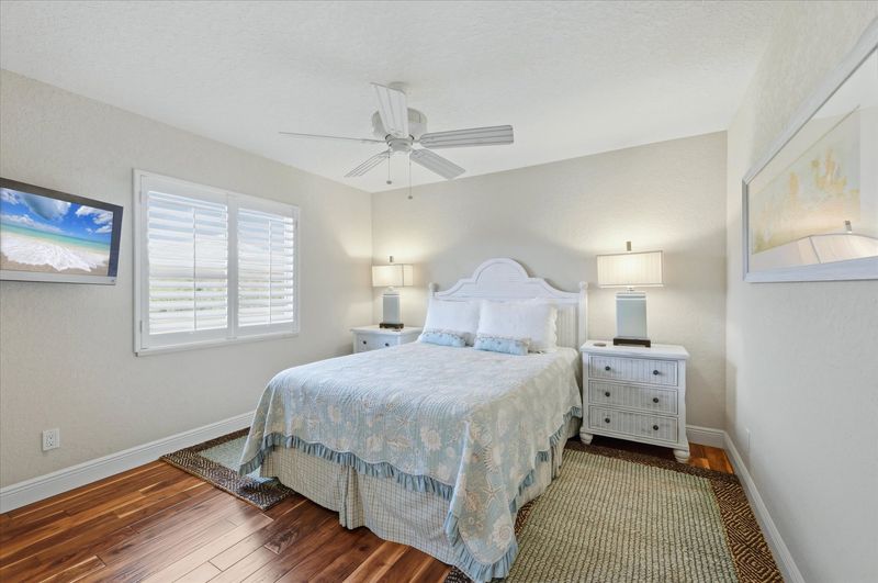 Guest bedroom 1 with queen bed and 32-inch Smart TV