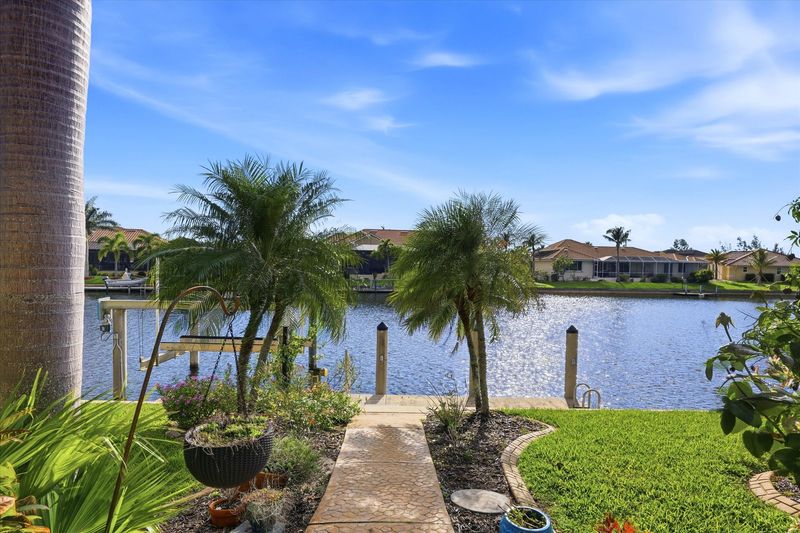 Path to canal and boat dock. Dock size: 7' x 30' with power & water