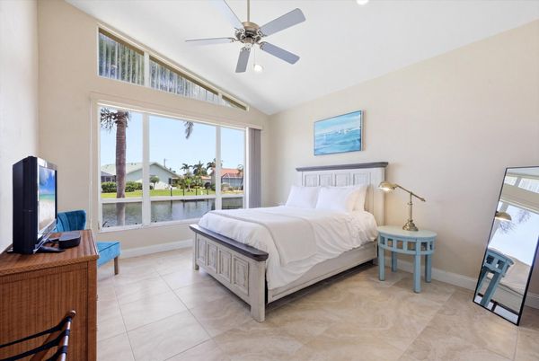 Bedroom 2 with queen bed and 32-inch Smart TV