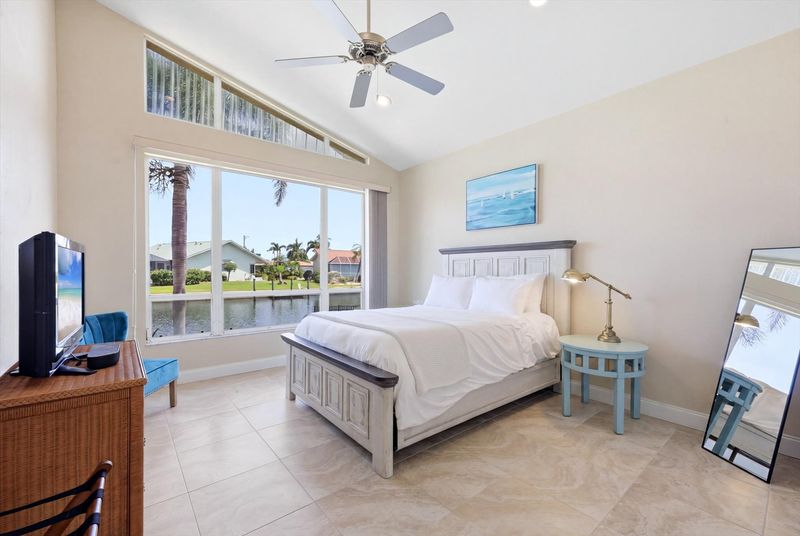 Bedroom 2 with queen bed and 32-inch Smart TV