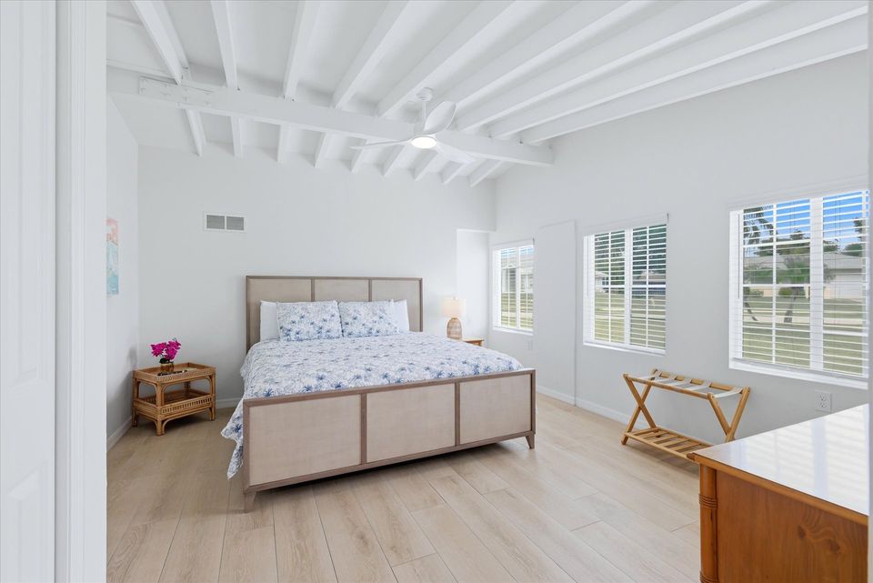 Primary bedroom with king bed, attached bathroom and 40-inch Smart TV