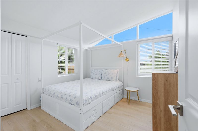Bedroom 2 with queen bed and 40-inch Smart TV