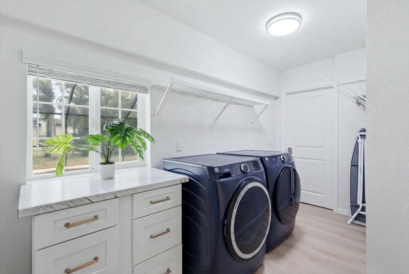 Laundry room with full-size washer & dryer