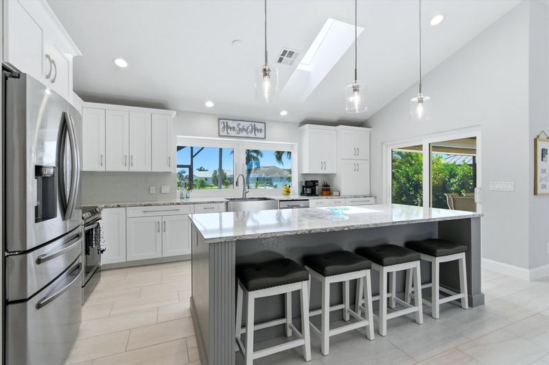 Beautiful, bright, fully-equipped kitchen with huge pass-through window